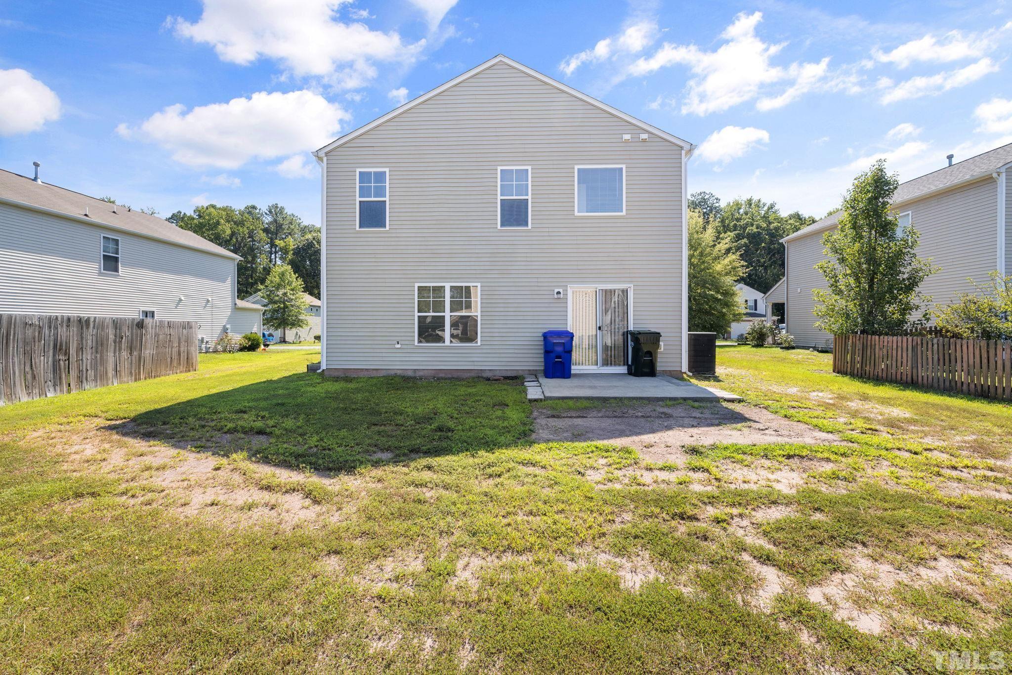 3519 Mountain Brook Circle Durham, NC 27704 - Photo 23 of 24 a view of a house with a yard and garage