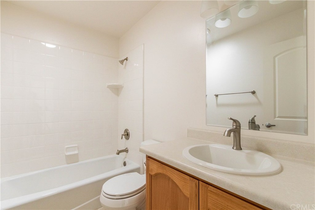 914 Brookhill Drive Paso Robles, CA 93446 - Photo 12 of 20 a bathroom with a sink a toilet and a bathtub
