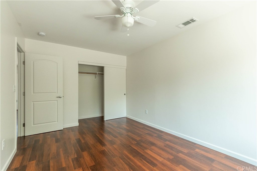 914 Brookhill Drive Paso Robles, CA 93446 - Photo 14 of 20 an empty room with wooden floor and fan