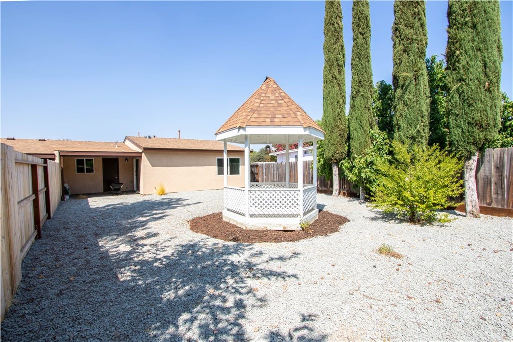 914 Brookhill Drive Paso Robles, CA 93446 - Photo 18 of 20 a front view of house with yard outdoor seating and covered with trees