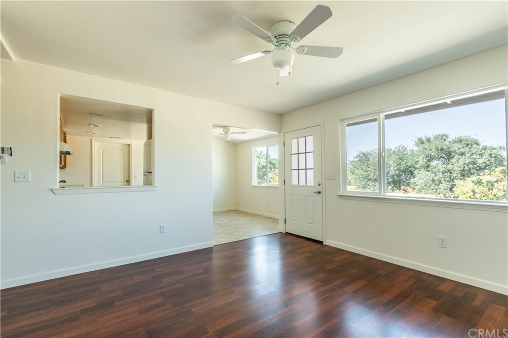 914 Brookhill Drive Paso Robles, CA 93446 - Photo 6 of 20 a view of an empty room with wooden floor and a window