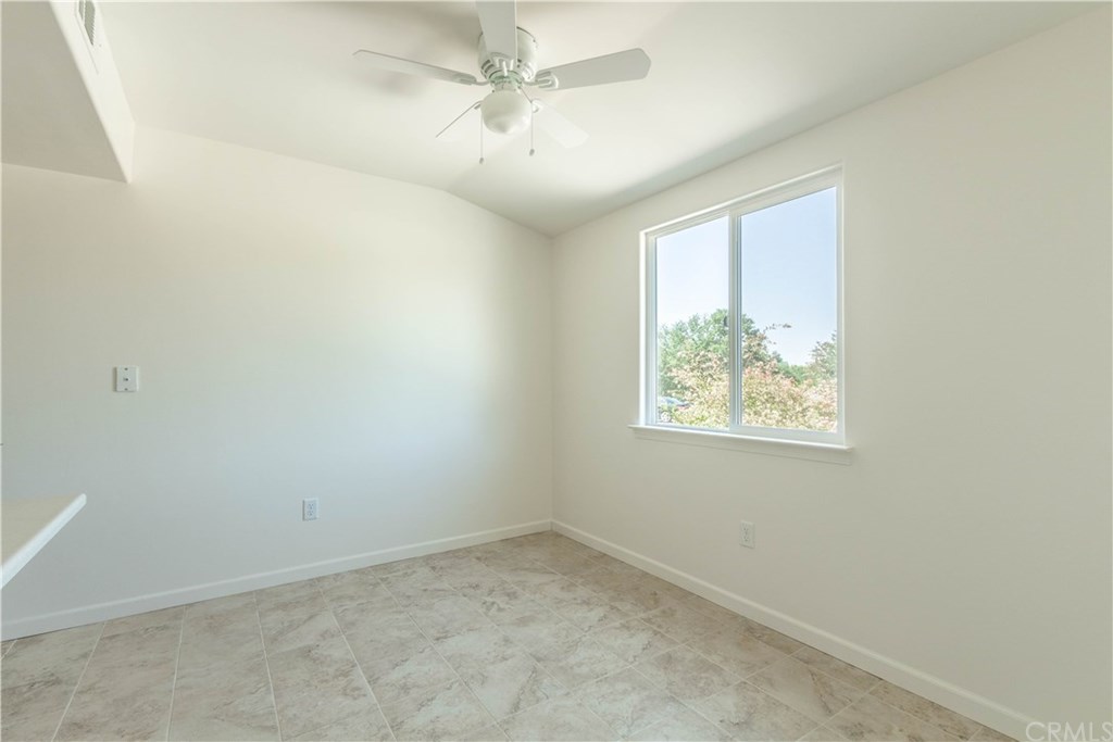 914 Brookhill Drive Paso Robles, CA 93446 - Photo 7 of 20 an empty room with a window and a fan