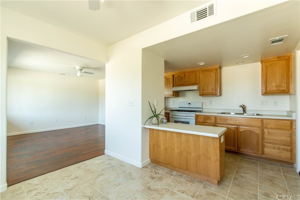 914 Brookhill Drive Paso Robles, CA 93446 - Photo 8 of 20 a large kitchen with cabinets