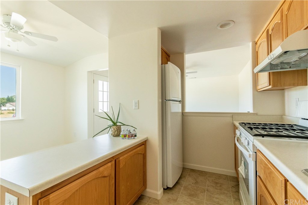 914 Brookhill Drive Paso Robles, CA 93446 - Photo 10 of 20 a kitchen with sink cabinets and stove