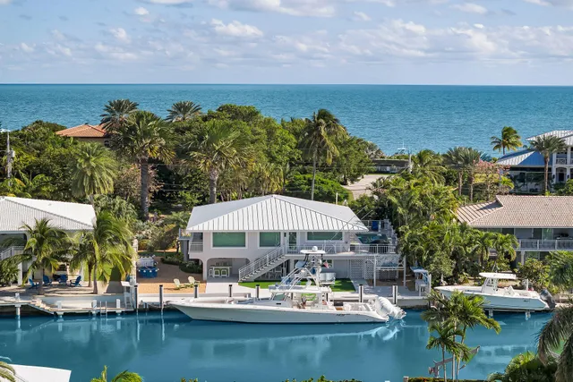 a view of a lake with couches and city view