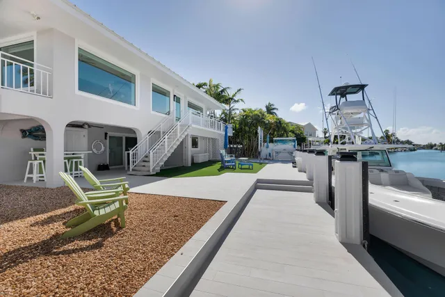 a view of a swimming pool with chair and table