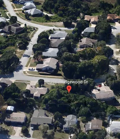 a front view of a building with outdoor seating