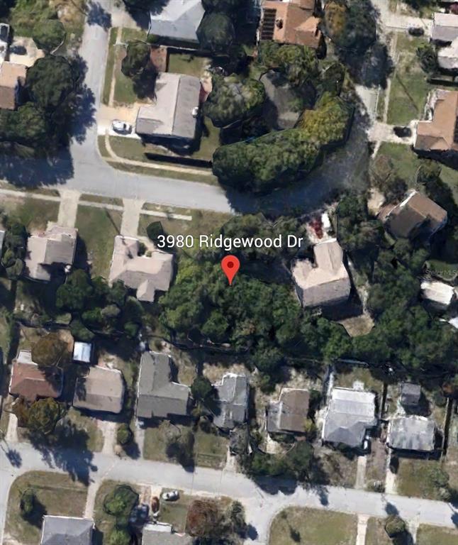 3980 Ridgewood Drive Titusville, FL 32796 - Photo 5 of 7 a front view of a building with outdoor seating