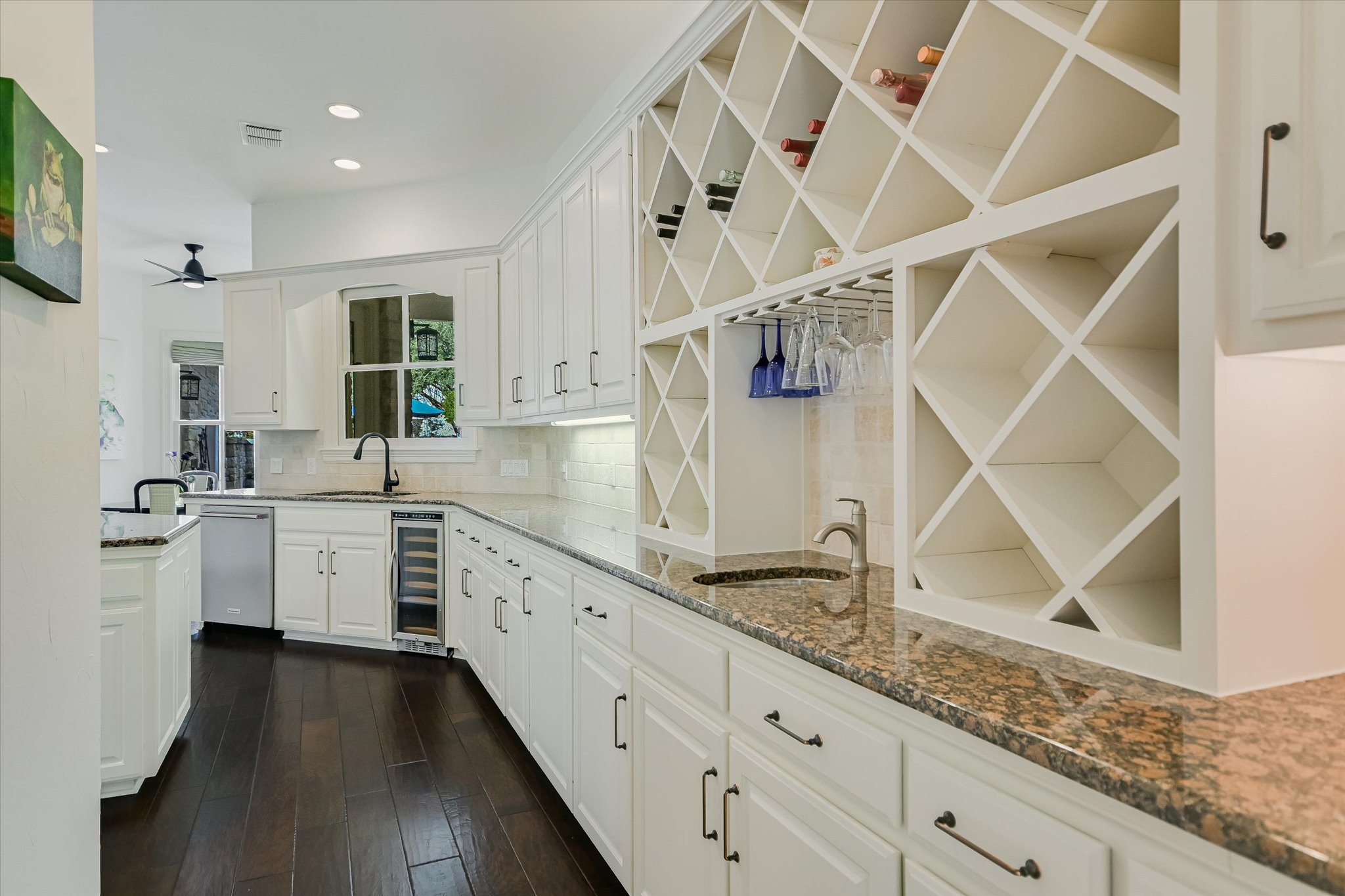 2901 Maravillas Loop Austin, TX 78735 - Photo 11 of 31 a kitchen with granite countertop white cabinets and white appliances