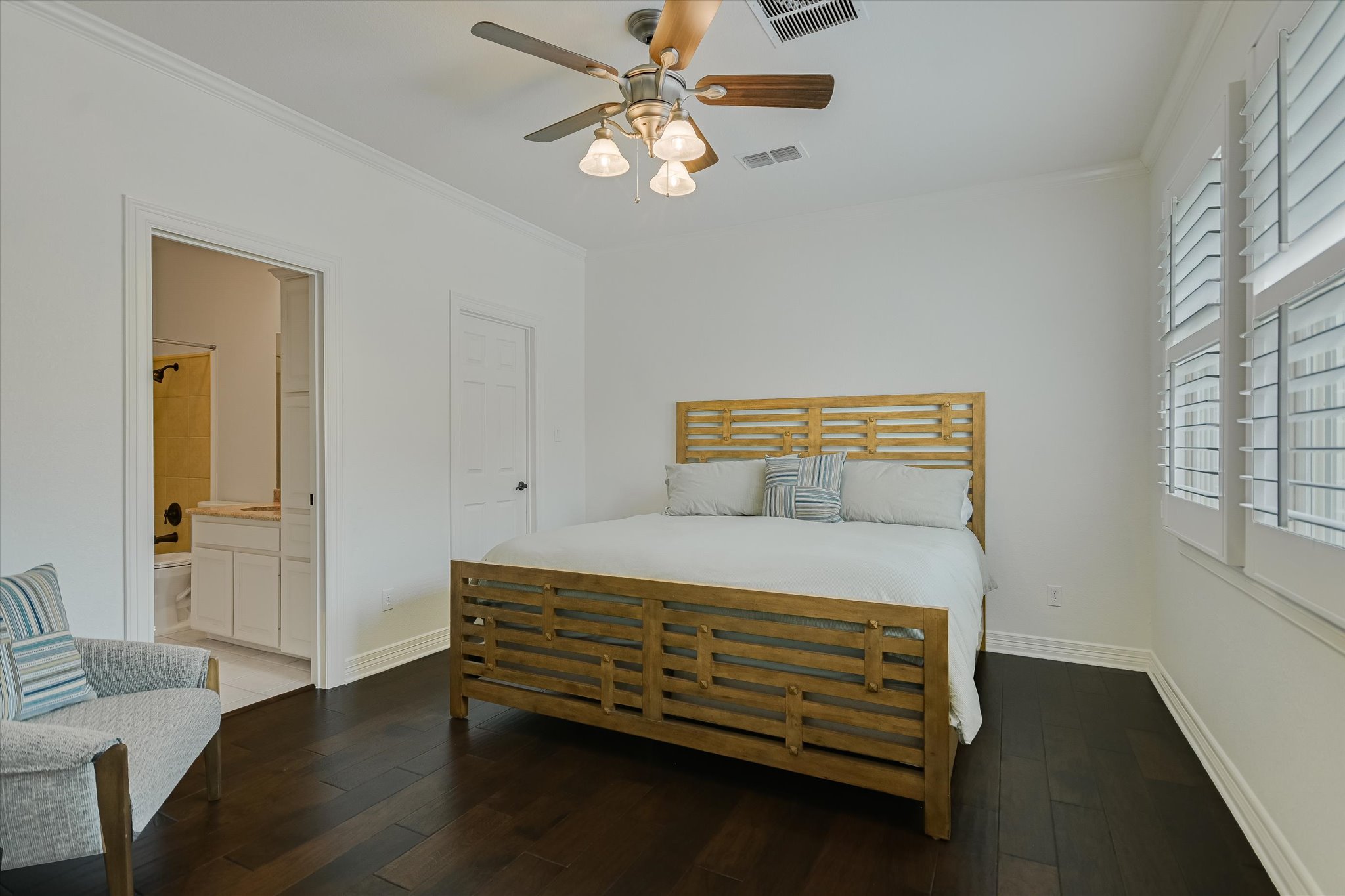 2901 Maravillas Loop Austin, TX 78735 - Photo 21 of 31 a bedroom with a bed and a chandelier
