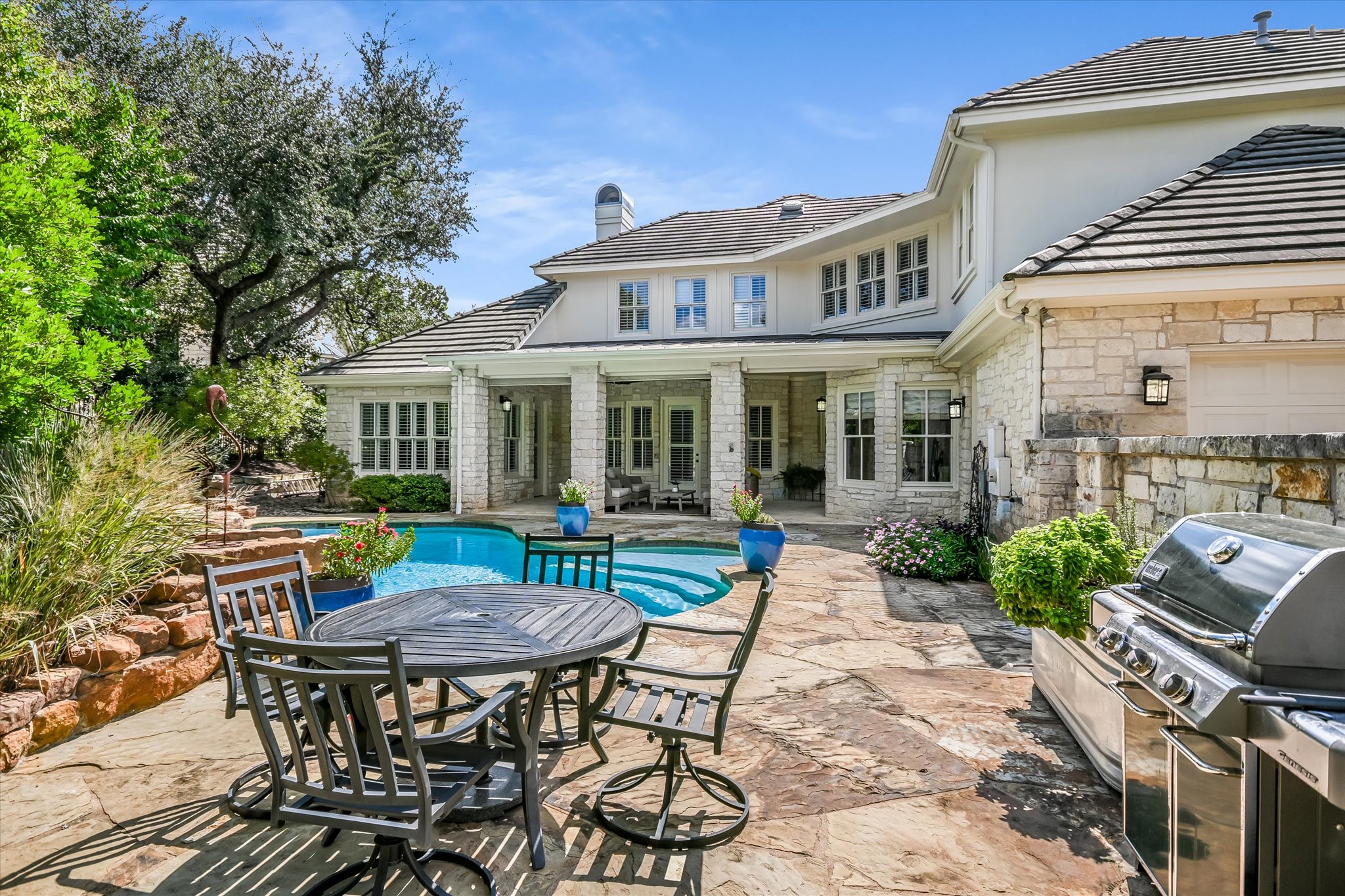 2901 Maravillas Loop Austin, TX 78735 - Photo 27 of 31 a view of house with a table and chairs in patio