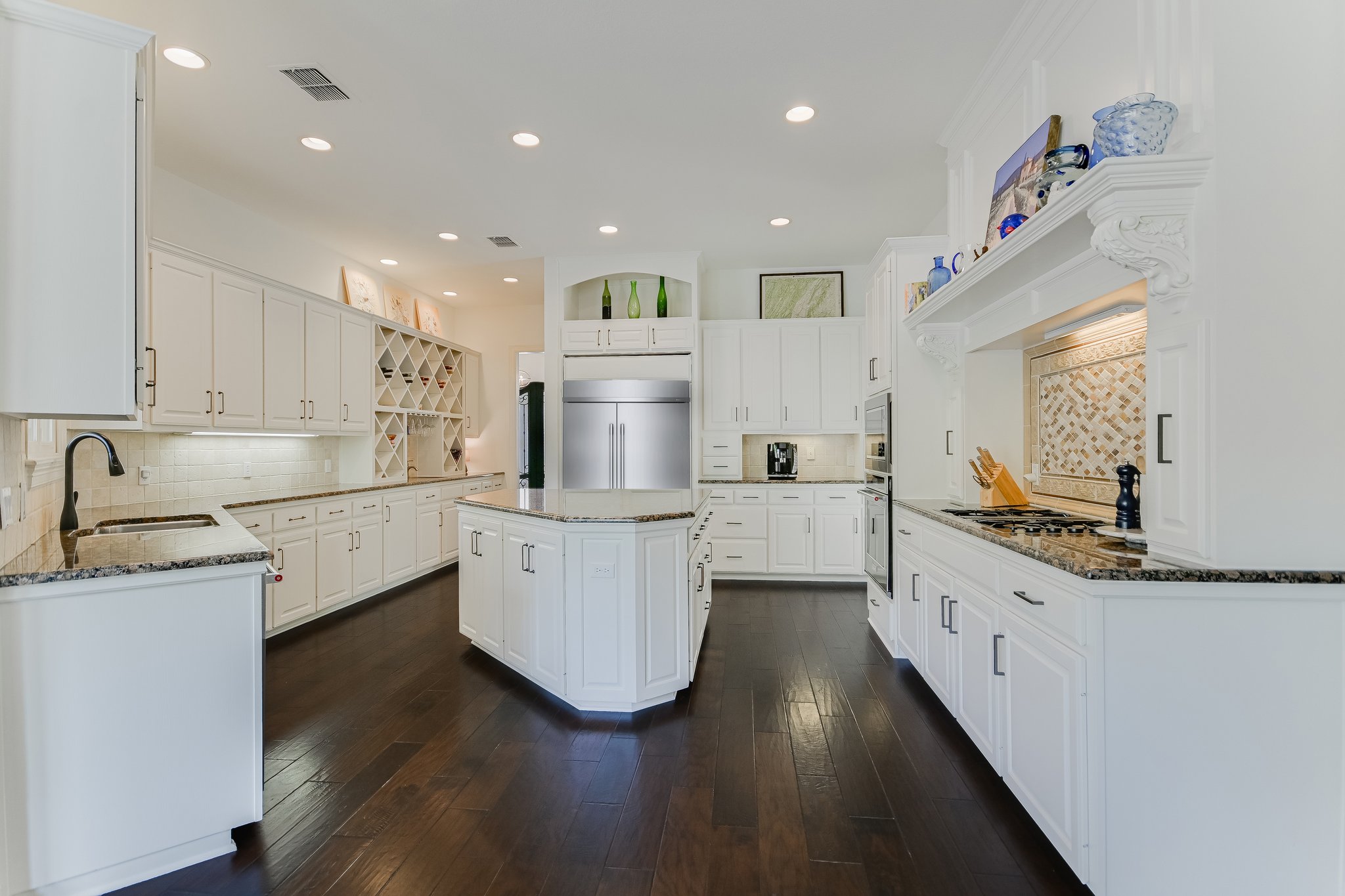 2901 Maravillas Loop Austin, TX 78735 - Photo 9 of 31 a kitchen with white cabinets appliances and sink