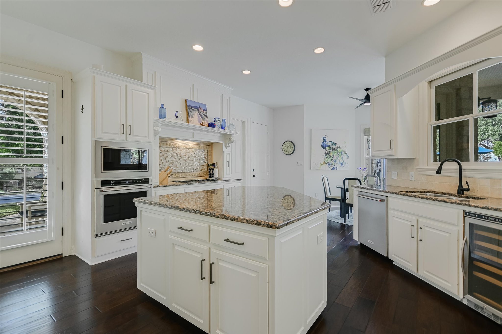 2901 Maravillas Loop Austin, TX 78735 - Photo 10 of 31 a kitchen with stainless steel appliances granite countertop a sink and dishwasher a stove with wooden floors