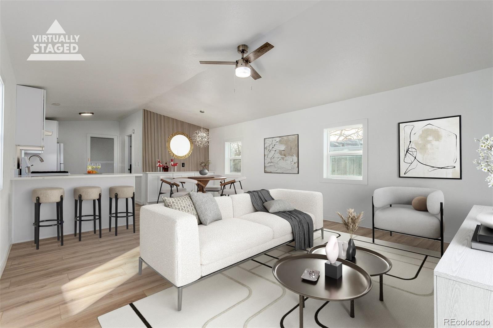 8466 Adams Way Denver, CO 80229 - Photo 1 of 31 a living room with furniture and a chandelier