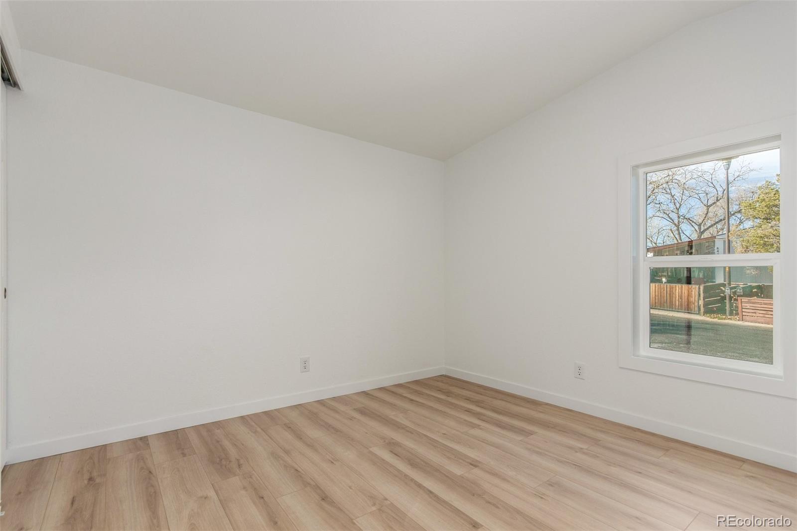 8466 Adams Way Denver, CO 80229 - Photo 26 of 31 an empty room with a window