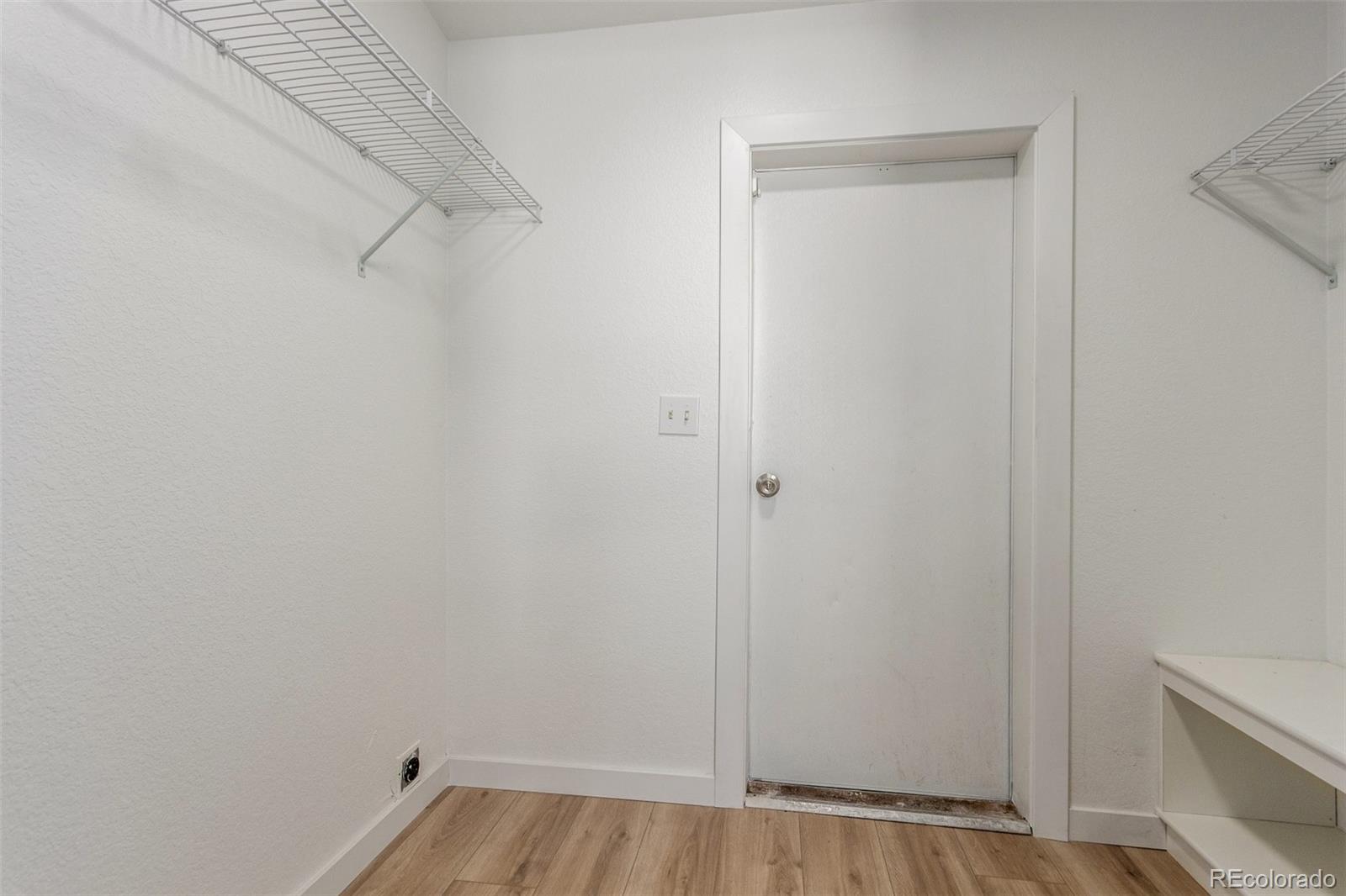 8466 Adams Way Denver, CO 80229 - Photo 29 of 31 a view of a room with racks on the wall