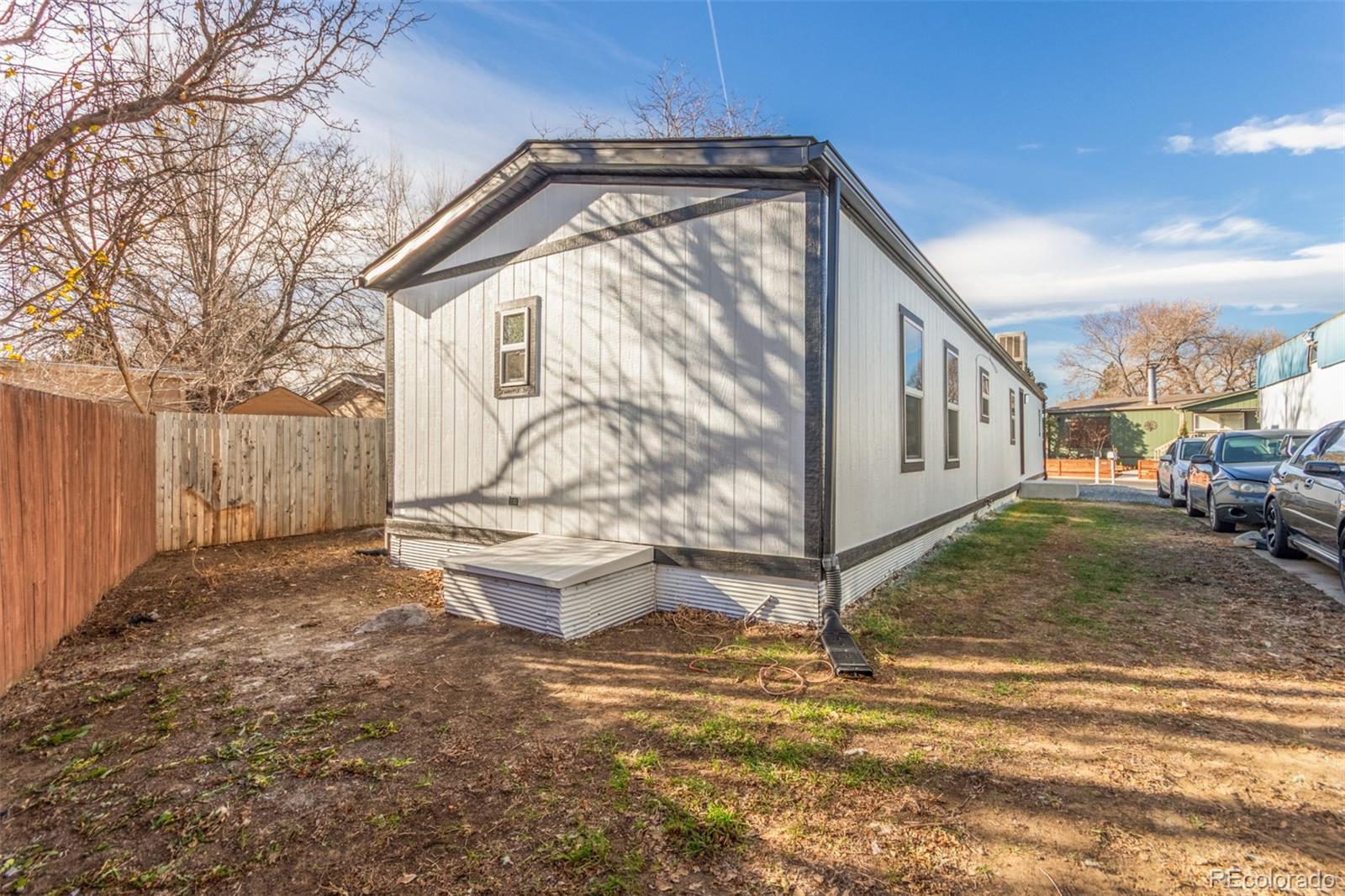 8466 Adams Way Denver, CO 80229 - Photo 31 of 31 a front view of a house with a yard