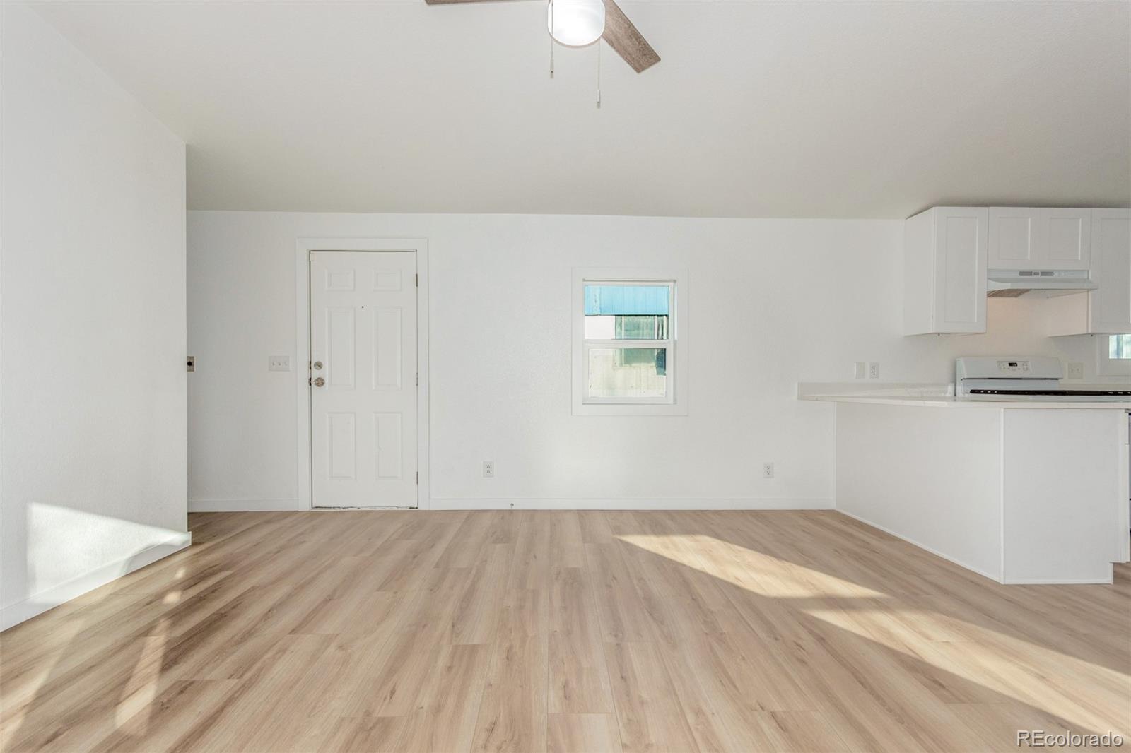 8466 Adams Way Denver, CO 80229 - Photo 10 of 31 wooden floor in an empty room