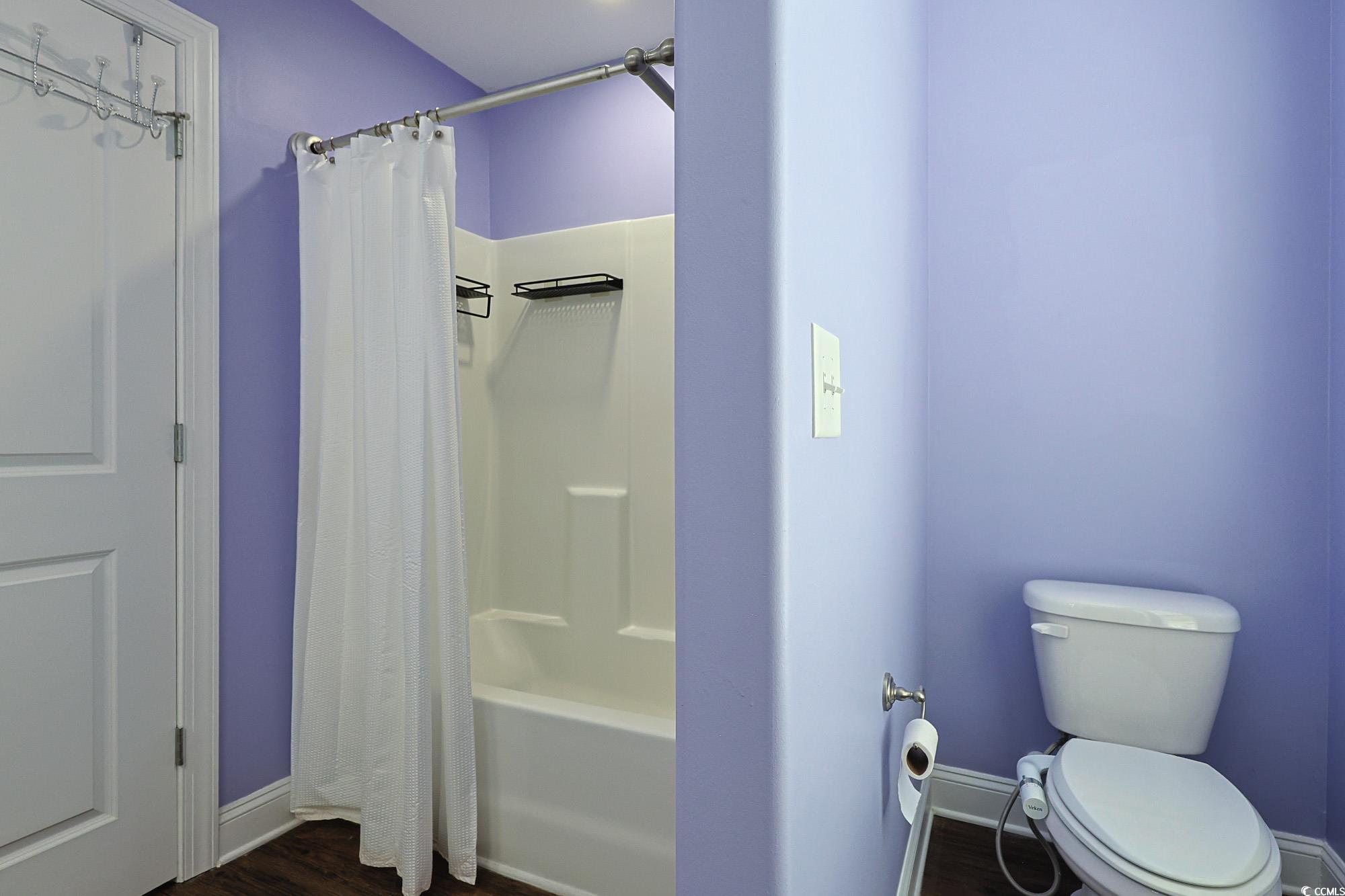 13 Daniel Morrall Lane Georgetown, SC 29440 - Photo 15 of 30 Full bath featuring dark wood-style flooring and shower / tub combo with curtain