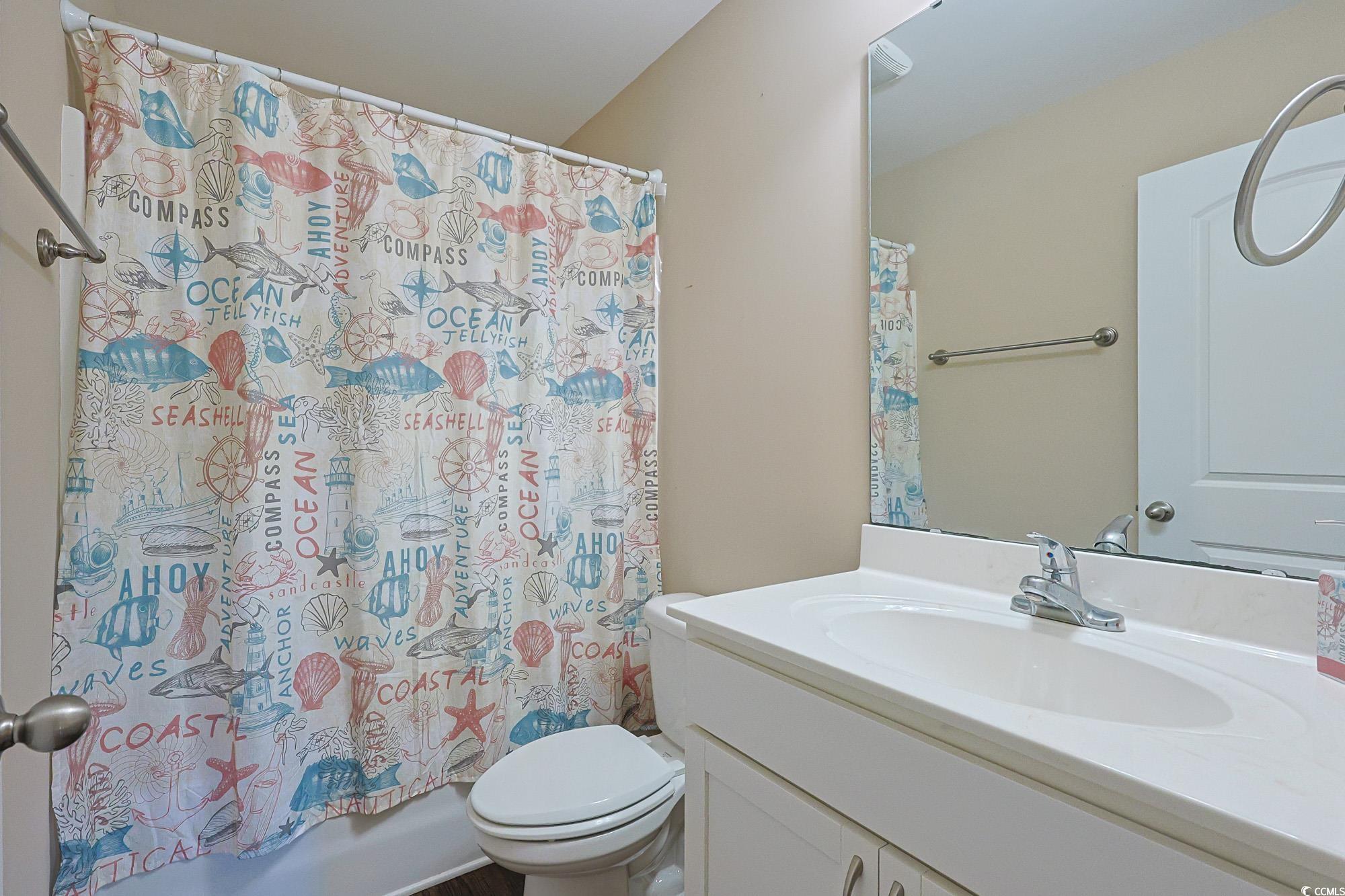 13 Daniel Morrall Lane Georgetown, SC 29440 - Photo 20 of 30 Bathroom featuring vanity and shower / bathtub combination with curtain