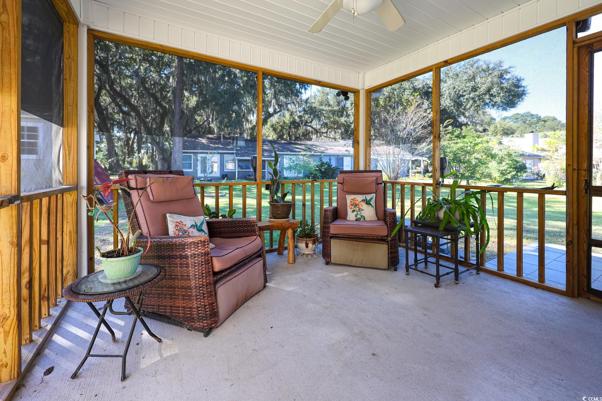 13 Daniel Morrall Lane Georgetown, SC 29440 - Photo 2 of 30 Sunroom / solarium featuring a ceiling fan and healthy amount of natural light