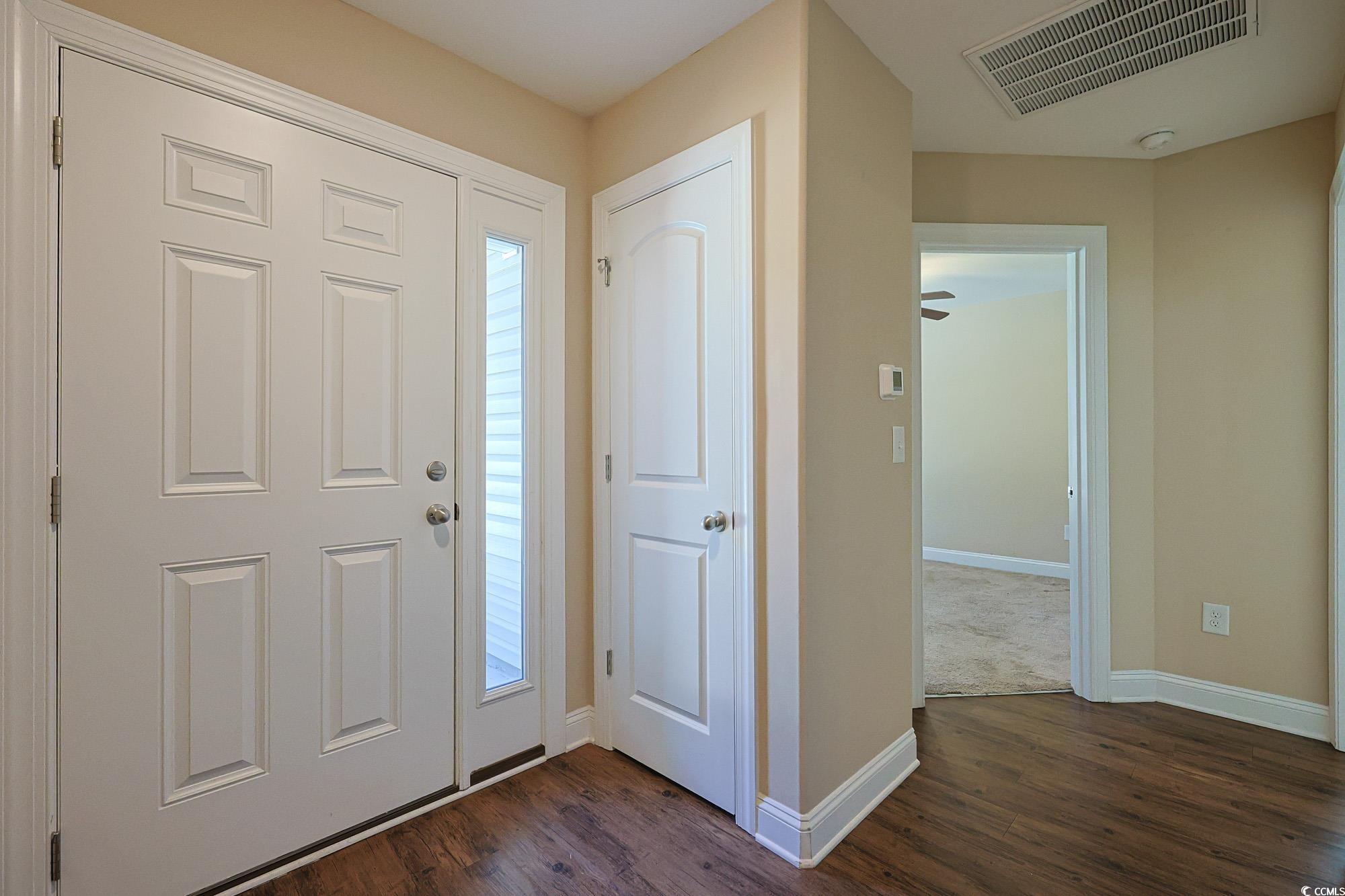 13 Daniel Morrall Lane Georgetown, SC 29440 - Photo 24 of 30 Foyer entrance featuring baseboards and dark wood-type flooring