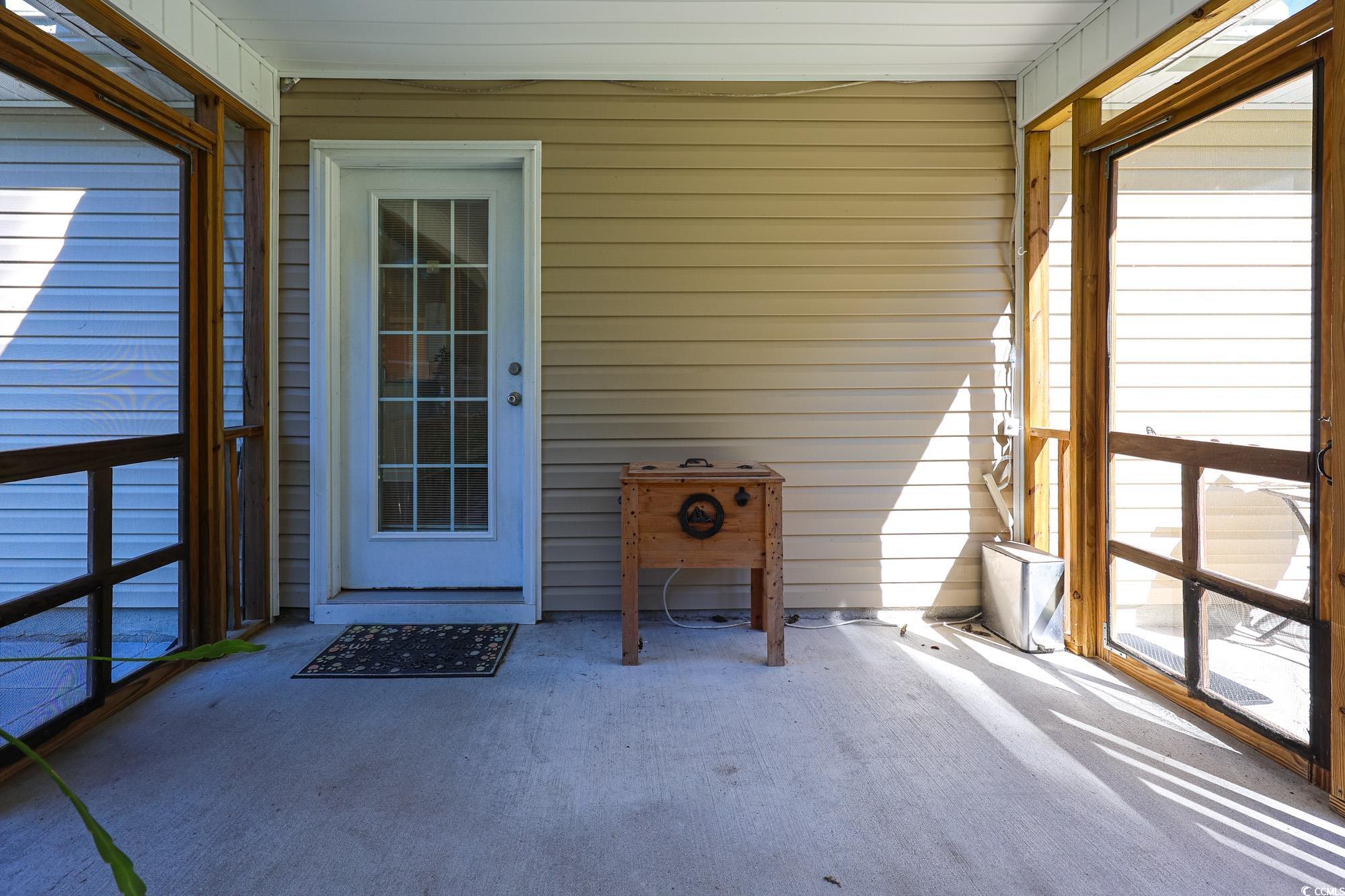 13 Daniel Morrall Lane Georgetown, SC 29440 - Photo 26 of 30 Unfurnished sunroom with a patio
