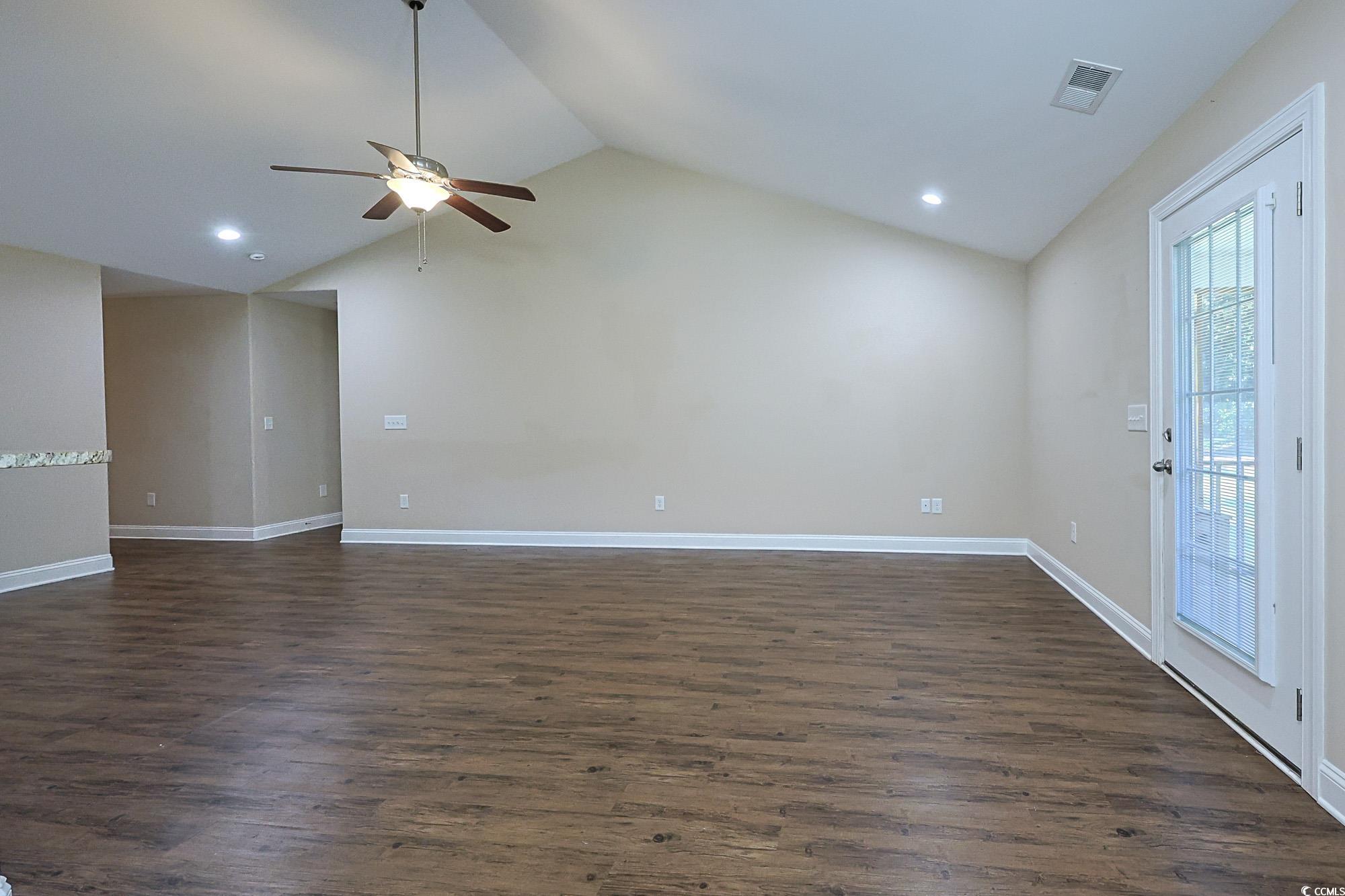 13 Daniel Morrall Lane Georgetown, SC 29440 - Photo 5 of 30 Spare room with dark wood-style flooring, recessed lighting, a ceiling fan, and high vaulted ceiling