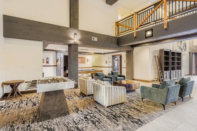 a living room with fireplace furniture and a flat screen tv