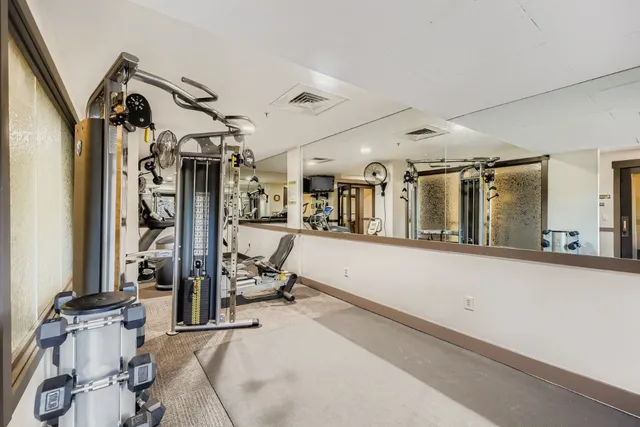 a view of swimming pool outdoor seating and city view