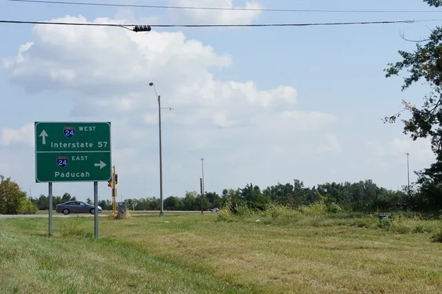 a view of a golf course with trees