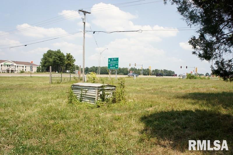 2134 East 5th Street Metropolis, IL 62960 - Photo 4 of 25 a view of a lake with a big yard