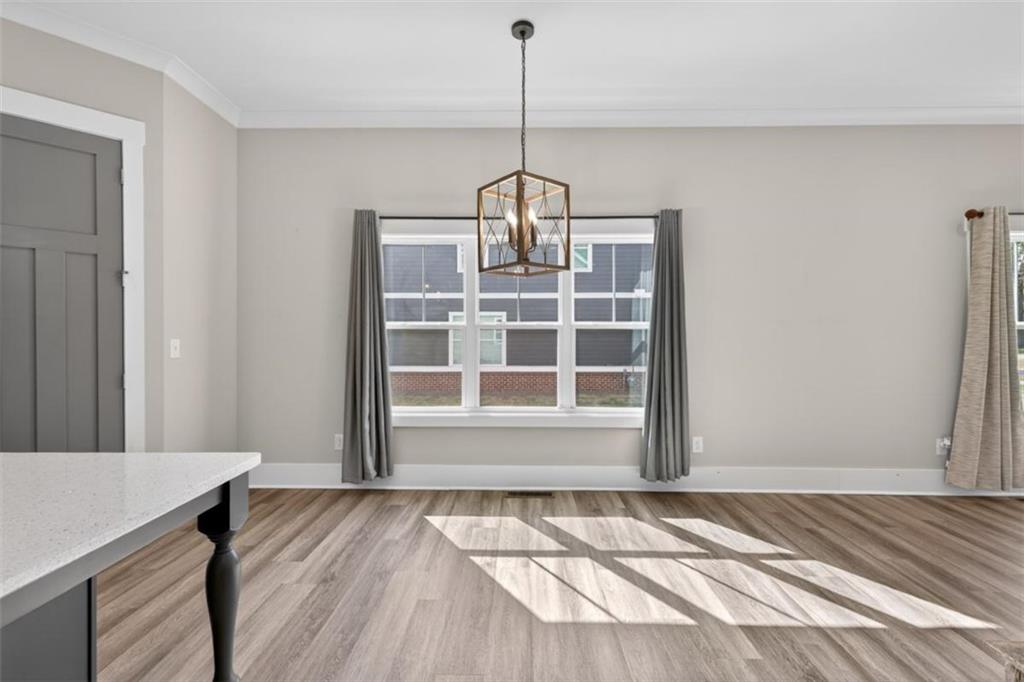 5118 Floyd Street Northeast Covington, GA 30014 - Photo 20 of 78 a view of wooden floor and windows in a room