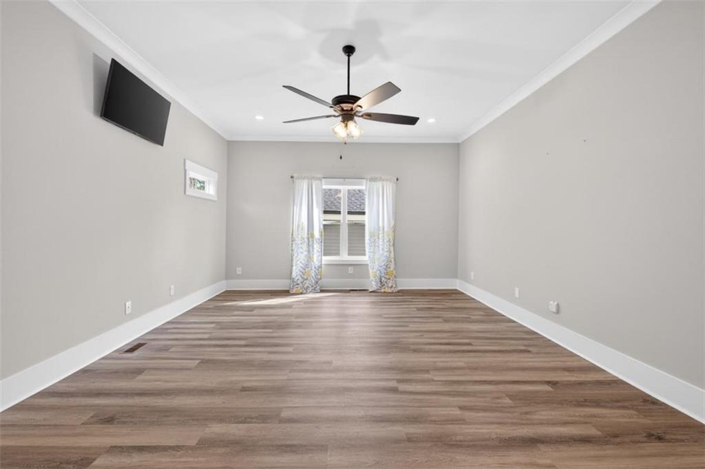 5118 Floyd Street Northeast Covington, GA 30014 - Photo 27 of 78 a view of an empty room with window and wooden floor