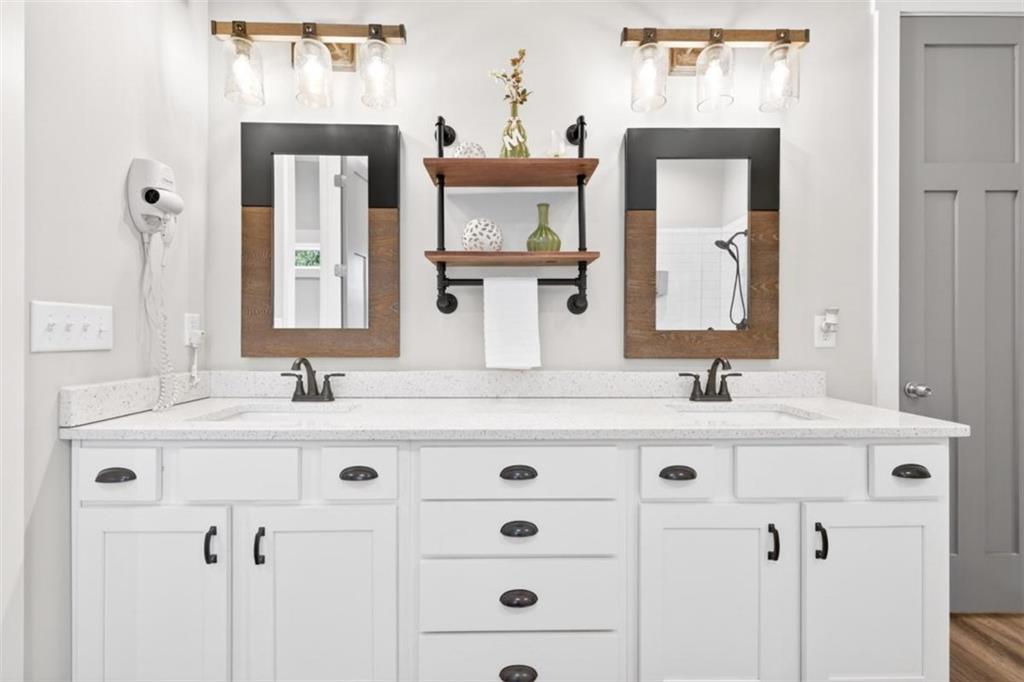 5118 Floyd Street Northeast Covington, GA 30014 - Photo 31 of 78 a bathroom with a sink vanity and a mirror