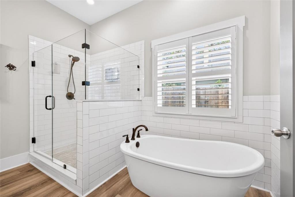 5118 Floyd Street Northeast Covington, GA 30014 - Photo 32 of 78 a white bath tub sitting next to a window