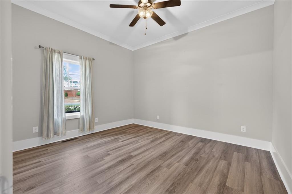 5118 Floyd Street Northeast Covington, GA 30014 - Photo 36 of 78 wooden floor in an empty room with a window
