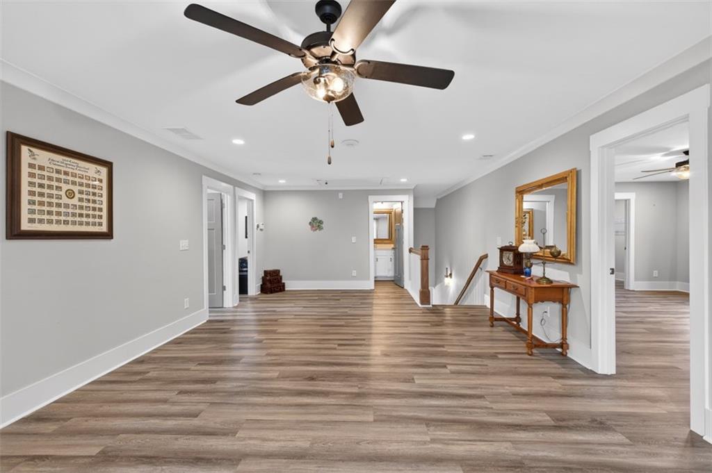 5118 Floyd Street Northeast Covington, GA 30014 - Photo 41 of 78 a view of a livingroom with furniture wooden floor and a ceiling fan