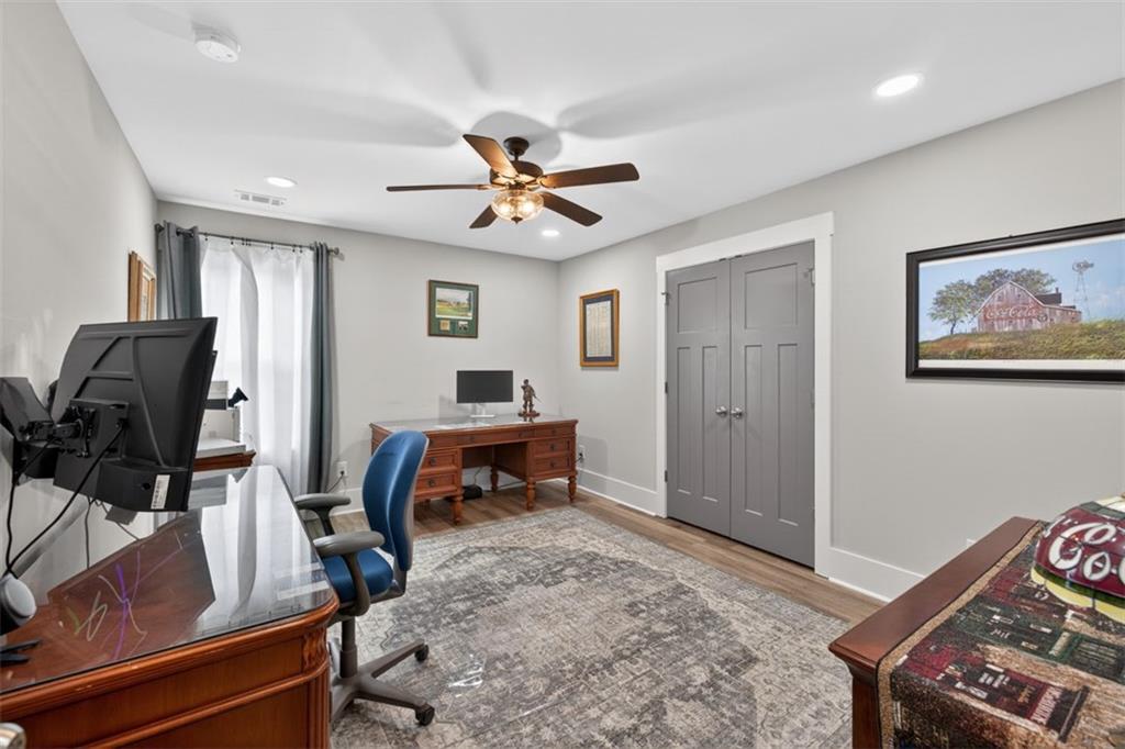 5118 Floyd Street Northeast Covington, GA 30014 - Photo 43 of 78 a view of a workspace with furniture and a window