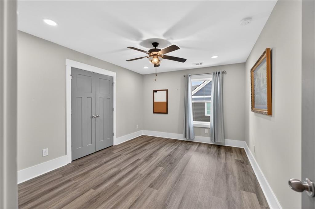 5118 Floyd Street Northeast Covington, GA 30014 - Photo 45 of 78 wooden floor in an empty room with a window