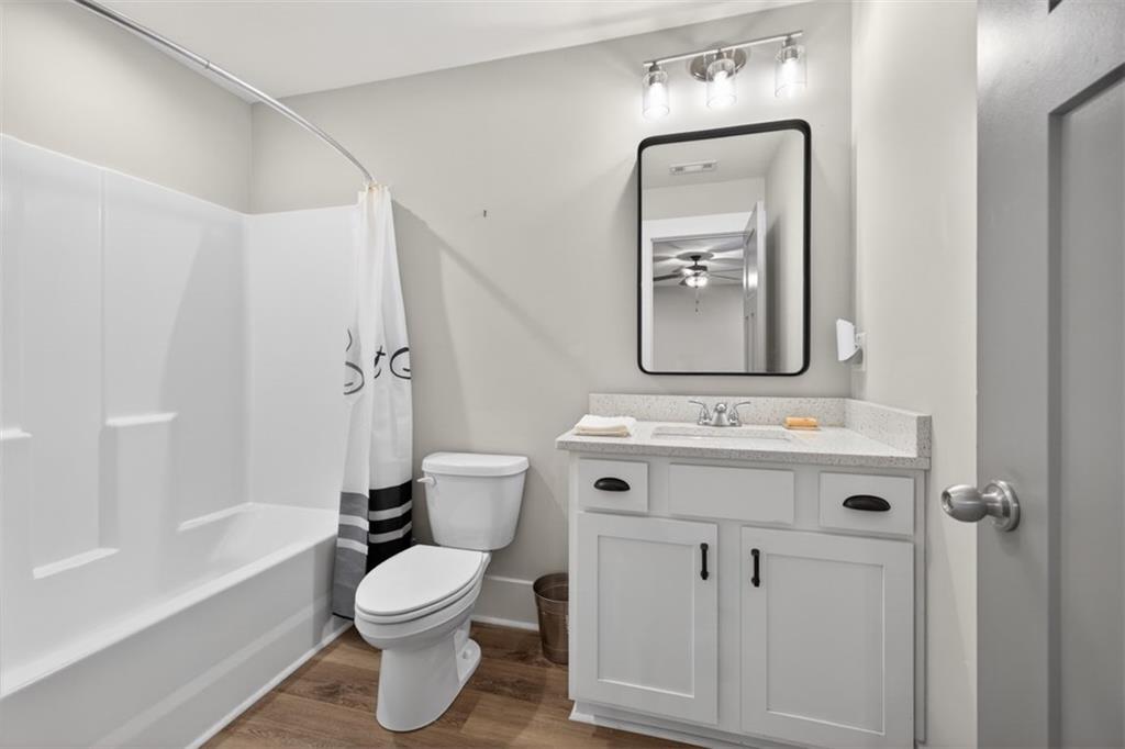 5118 Floyd Street Northeast Covington, GA 30014 - Photo 53 of 78 a bathroom with a toilet a sink and bathtub