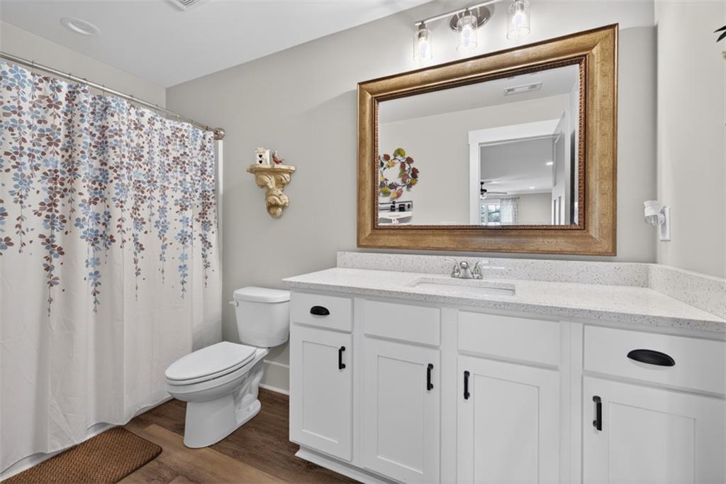 5118 Floyd Street Northeast Covington, GA 30014 - Photo 55 of 78 a bathroom with a toilet sink and mirror