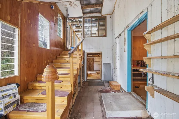 a view of an empty room with windows
