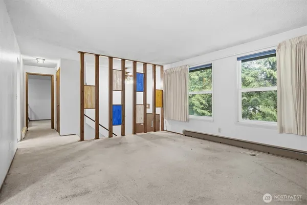 a view of an empty room with a window