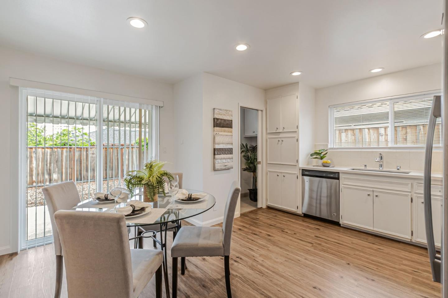 844-846 Doyle Road San Jose, CA 95129 - Photo 15 of 38 a kitchen with a dining table chairs and refrigerator