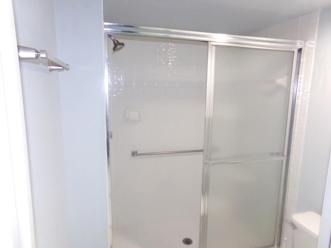 9563 Weldon Circle, Unit D110 Tamarac, FL 33321 - Photo 17 of 37 master bedroom bath