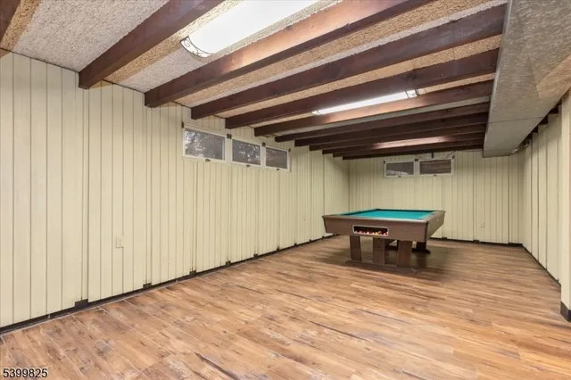 a view of a room with table and chairs