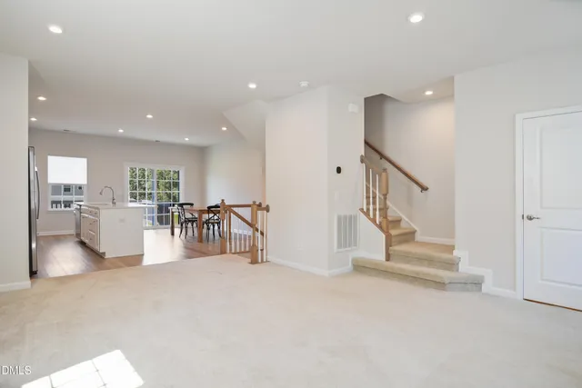 a kitchen with a sink a stove and cabinets