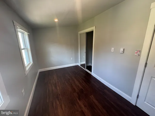 a bathroom with a sink toilet and mirror