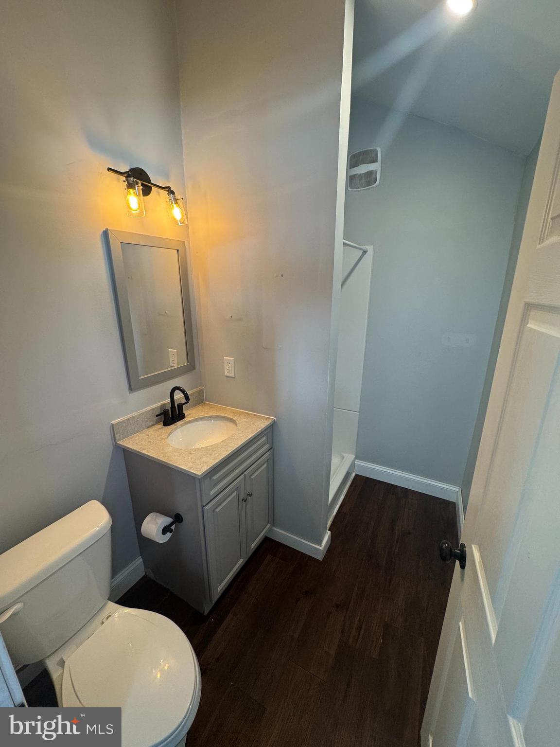619 Gregg Avenue Reading, PA 19611 - Photo 15 of 18 a bathroom with a sink toilet and mirror
